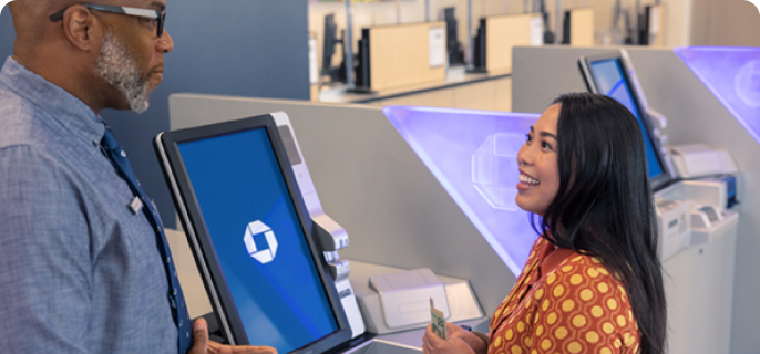 A Chase Premier Savings customer uses an ATM at their local branch